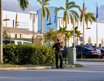 Police outside the U.S. Post Office Royal Palm Processing