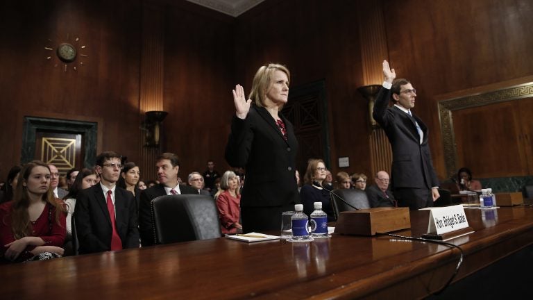 Appellate court nominees Bridget S. Bade and Eric D. Miller are sworn in during a hearing held by the Senate Judiciary Committee on Wednesday. Only two senators — Mike Crapo, R-Idaho, and Orrin Hatch, R-Utah — were in attendance. (Win McNamee/Getty Images)