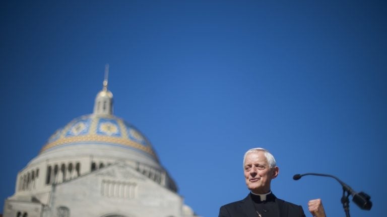 Cardinal Donald Wuerl speaks in front of the Basilica of the National Shrine of the Immaculate Conception in Washington, D.C. in 2015. Wuerl resigned on Friday after accusations of covering up sexual abuse.