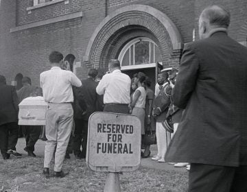 A white casket containing the body of 14-year-old Carol Robertson, one of four young African-American girls killed in the 16th Street Baptist Church bombing by Ku Klux Klan members, is carried in for funeral services in 1963 in Birmingham, Ala. (Bettmann/Bettmann Archive via Getty Images)
