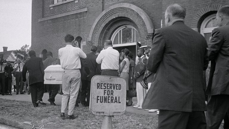 A white casket containing the body of 14-year-old Carol Robertson, one of four young African-American girls killed in the 16th Street Baptist Church bombing by Ku Klux Klan members, is carried in for funeral services in 1963 in Birmingham, Ala. (Bettmann/Bettmann Archive via Getty Images)