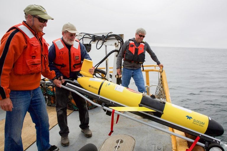 Oregon State University oceanographer Jack Barth deploys a glider that will spend weeks at sea collecting data on everything from dissolved oxygen levels to temperature. 