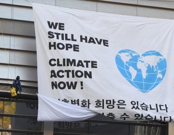 Greenpeace activists hang a banner prior to a press conference of the Intergovernmental Panel for Climate Change (IPCC) in Incheon, South Korea. The landmark U.N. report on limiting global warming to 1.5 degrees Celsius was released after a week-long meeting of the IPCC's 195 member nations.