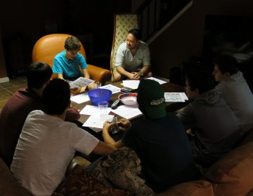 Cody Greenes (center), 35, group leader with the Jewish organization Moving Traditions, leads six high school freshman boys in a discussion about sexual assault and consent.