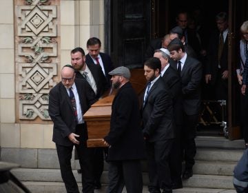 Pallbearers carry the caskets of brothers Cecil Rosenthal, 59, and David Rosenthal, 54, on Tuesday in Pittsburgh, Pa. The brothers were among 11 killed in the mass shooting at the Tree of Life Synagogue last Saturday.