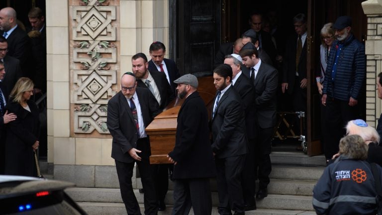 Pallbearers carry the caskets of brothers Cecil Rosenthal, 59, and David Rosenthal, 54, on Tuesday in Pittsburgh, Pa. The brothers were among 11 killed in the mass shooting at the Tree of Life Synagogue last Saturday.