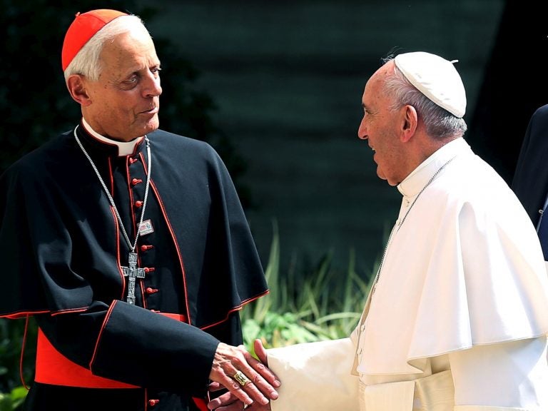 Pope Francis has accepted the resignation of the Archbishop of Washington, Cardinal Donald Wuerl. The two are seen here during the pope's visit to Washington, D.C., in 2015.