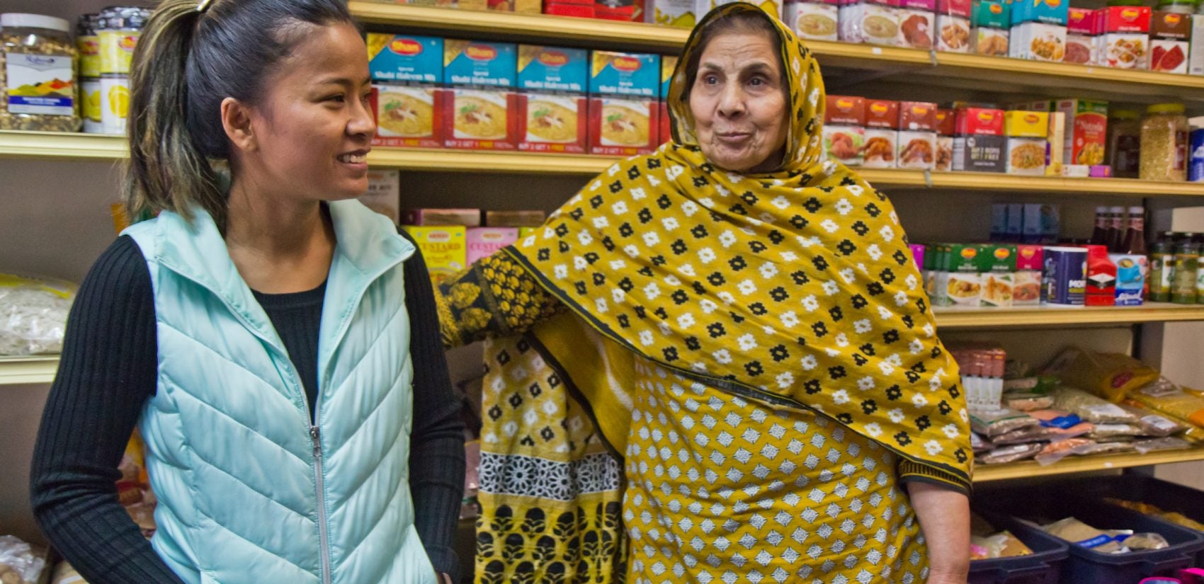 Somaly Osteen (left) won the Instigator Award for her work on the South 7th Street commercial corridor. Irshad Aslam (right) has owned the Aslam Market since 1986. (Kimberly Paynter/WHYY)