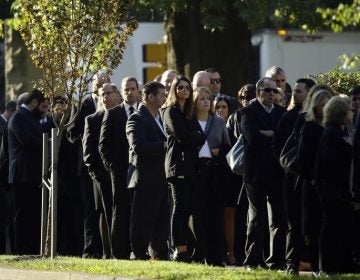 Mourners gather outside Rodef Shalom Congregation before the funeral services for brothers Cecil and David Rosenthal, Tuesday, Oct. 30, 2018, in Pittsburgh. The brothers were killed in the mass shooting Saturday at the Tree of Life Synagogue. (Matt Rourke/AP Photo)