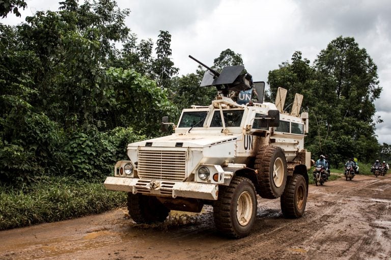 A U.N. military truck patrols on the road linking Mangina to Beni, the current epicenter of the Ebola outbreak in Democratic Republic of the Congo. (John Wessels/Getty Images)