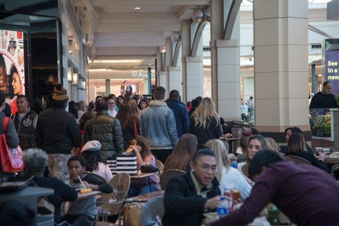 Shoppers pass around the crowds of the food court as others take a lunch break on Black Friday at the King of Prussia Mall in Pennsylvania November 23rd 2018. (Emily Cohen for WHYY)