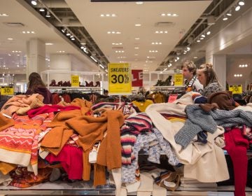 Sweaters are strewn about at Forever 21 on Black Friday at the King of Prussia Mall. (Emily Cohen for WHYY)