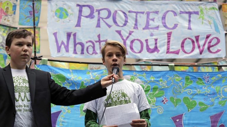 Two young people speak at a rally Monday in Seattle. The Supreme Court said it would not stop the lawsuit that inspired this rally, along with others in Portland and Eugene, Ore.
(Elaine Thompson/AP)