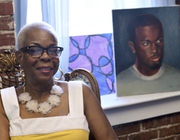 Dorothy Johnson-Speight, founder of Mothers in Charge, sitting before a painting of her murdered son, Khaliiq Jabbar Johnson. (Bastiaan Slabbers for Keystone Crossroads)