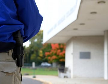 Security guard Donald Mee stands near the entrance of Congregation Adath Jeshurun, in Elkins Park, on Wednesday, Oct. 31, 2018. (Bastiaan Slabbers for WHYY)