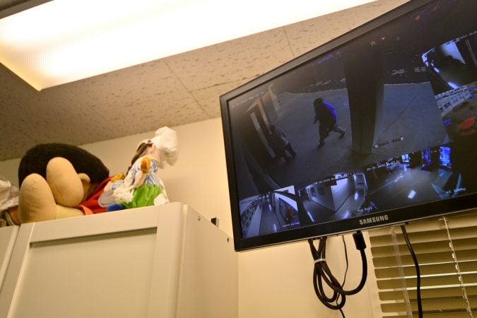 Security guard Donald Mee is seen at the front door on a monitor In the main office at Congregation Adath Jeshurun, in Elkins Park, on Wednesday, Oct. 31, 2018. (Bastiaan Slabbers for WHYY)