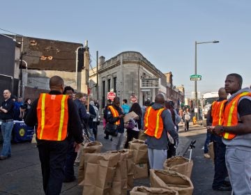 Philadelphia city workers and community groups work to clean up the streets of Kensington. (Kimberly Paynter/WHYY)