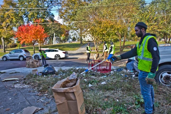 Members of Power Corp clean up around McPherson Square in Kensington. (Kimberly Paynter/WHYY)