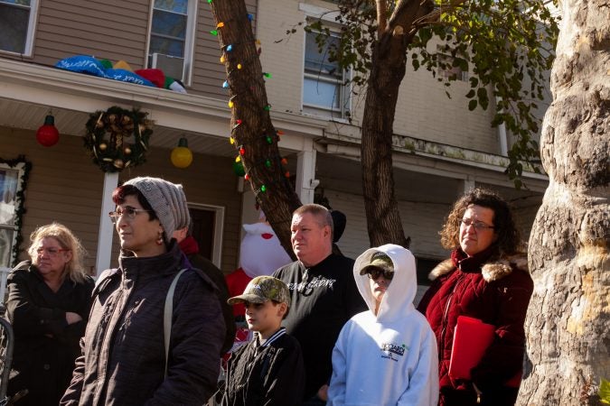 Sixteen Tacony residents and neighbors came out on Saturday to show support for the Mella family after they received a threatening and racist letter earlier this month. (Brad Larrison for WHYY)