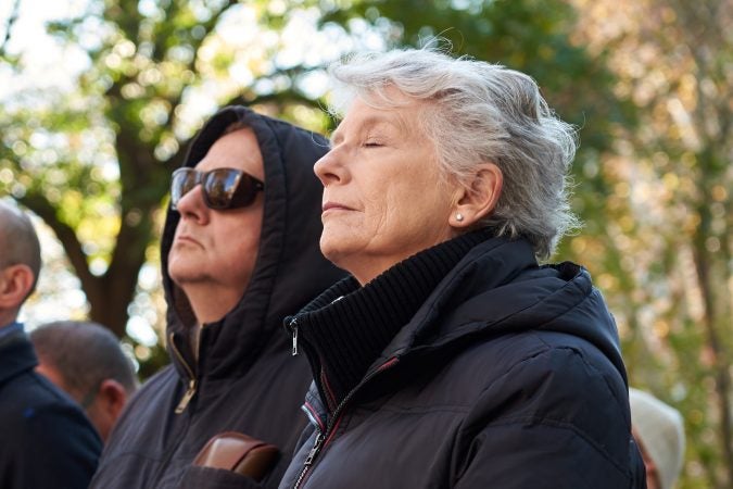 Fran LaRose, a lifelong Philadelphia resident, watches as the bells ring at 11:11 a.m. at Independence National Historical Park on Nov. 11, 2018 in celebration of the centennial anniversary of Armistice Day. Her father was a WWII Veteran. 