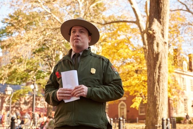 Paul Campbell, a park ranger at Independence National Historical Park in Philadelphia leads the bell ringing ceremony to commemorate the centennial of Armistice Day on Nov. 11, 2018. (Natalie Piserchio for WHYY)