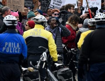 Counter-protesters shout at those taking part in the 