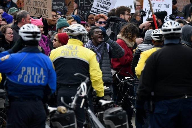 Counter-protesters shout at those taking part in the 