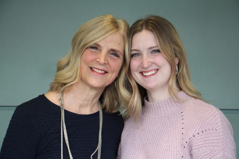 Aubrey Fink (right) created The Bridge Magazine, a literary manual about woman-hood, that fosters cross-generational conversations. She is pictured with her mother, Kim Fink. (Emma Lee/WHYY)