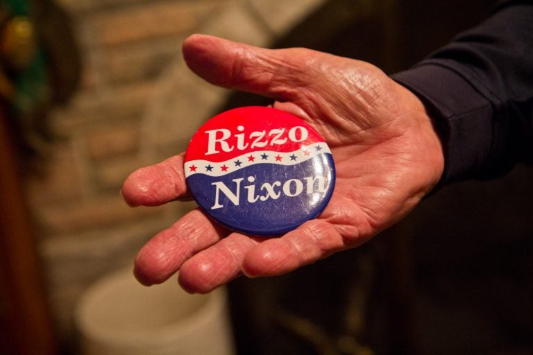 Frank Rizzo Jr. holds a campaign button with the Nixon/Rizzo ticket. (Kimberly Paynter/WHYY)