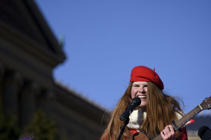 Catie Turner, a 2018 American Idol contestant from Bucks County, performs during the televised component of the 99th annual Thanksgiving Day Parade in front of the Art Museum. (Bastiaan Slabbers for WHYY)