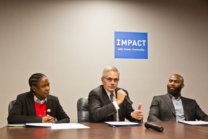 Philadelphia District Attorney Larry Krasner speaks at a “No Cash Bail” event with bail navigator LaTonya Myers and Eagles safety Malcolm Jenkins.(Kimberly Paynter/WHYY)