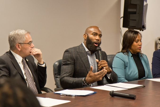 Eagles safety Malcolm Jenkins talks about Philadelphia’s cash-bail system with community organizers. (Kimberly Paynter/WHYY)
