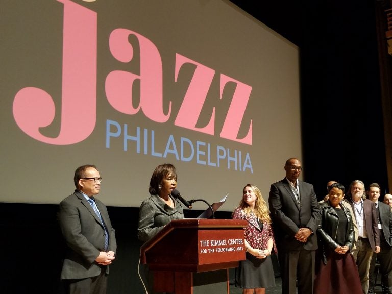 Philadelphia Councilwoman Blondell Reynolds Brown reads a resolution in support of Jazz Philadelphia at the opening of a jazz summit in the Kimmel Center. Councilman David Oh is at left. (Peter Crimmins/WHYY)
