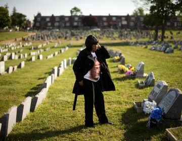 Dorothy Johnson-Speight visits the grave of her son, Khaaliq Jabbar Johnson, in Philadelphia on Monday, May 9, 2016. Johnson was killed in 2001 - shot seven times over a parking space dispute. (AP Photo/Matt Rourke)