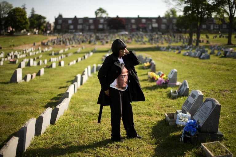 Dorothy Johnson-Speight visits the grave of her son, Khaaliq Jabbar Johnson, in Philadelphia on Monday, May 9, 2016. Johnson was killed in 2001 - shot seven times over a parking space dispute. (AP Photo/Matt Rourke)