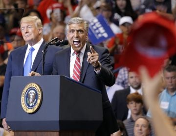 President Donald Trump listens to then-Senate candidate and U.S. Rep. Lou Barletta, R-Pa., speak during a rally, Thursday, Aug. 2, 2018, at Mohegan Sun Arena at Casey Plaza in Wilkes Barre, Pa. (AP Photo/Carolyn Kaster)