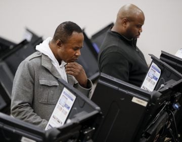 Voters use electronic polling machines as they cast their votes early at the Franklin County Board of Elections, Wednesday, Oct. 31, 2018, in Columbus, Ohio. (John Minchillo/AP Photo)