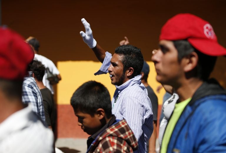 A group of Central American migrants, representing the thousands participating in a caravan trying to reach the U.S. border, undertake an hours-long march to the office of the United Nations' humans rights body in Mexico City, Thursday, Nov. 8, 2018. Members of the caravan which has stopped in Mexico City demanded buses Thursday to take them to the U.S. border, saying it is too cold and dangerous to continue walking and hitchhiking.(AP Photo/Rebecca Blackwell)