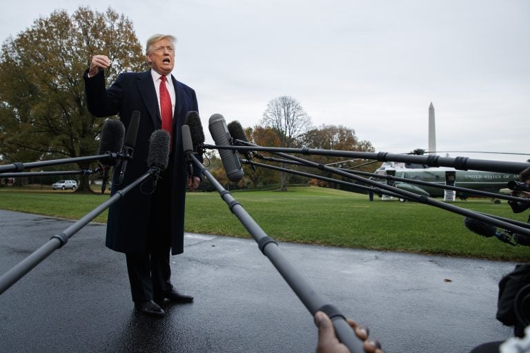 President Donald Trump talks with reporters before departing for France on the South Lawn of the White House, Friday, Nov. 9, 2018, in Washington. (AP Photo/Evan Vucci)