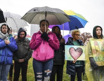 Attendees stand during a moment of silence during the Rally for Peace and Tree of Life Victims, Friday, Nov. 9, 2018, at Point State Park in downtown Pittsburgh. (Alexandra Wimley/Pittsburgh Post-Gazette via AP)