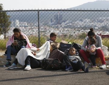 Central American migrants rest outside a soccer stadium after arriving in Queretaro, Mexico, as they resume their journey north, Saturday, Nov. 10, 2018. Thousands of Central American migrants were back on the move toward the U.S. border Saturday, after dedicated Mexico City metro trains whisked them to the outskirts of the capital and drivers began offering rides north. (AP Photo/Marco Ugarte)