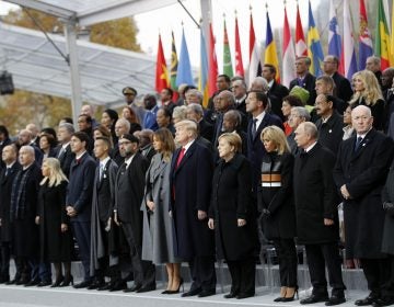 Heads of states and world leaders attend ceremonies at the Arc de Triomphe Sunday, Nov. 11, 2018 in Paris. Over 60 heads of state and government were taking part in a solemn ceremony at the Tomb of the Unknown Soldier, the mute and powerful symbol of sacrifice to the millions who died from 1914-18. (AP Photo/Francois Mori, Pool)