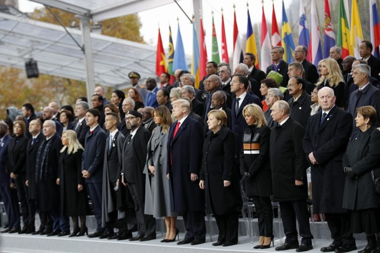 Heads of states and world leaders attend ceremonies at the Arc de Triomphe Sunday, Nov. 11, 2018 in Paris. Over 60 heads of state and government were taking part in a solemn ceremony at the Tomb of the Unknown Soldier, the mute and powerful symbol of sacrifice to the millions who died from 1914-18. (AP Photo/Francois Mori, Pool)