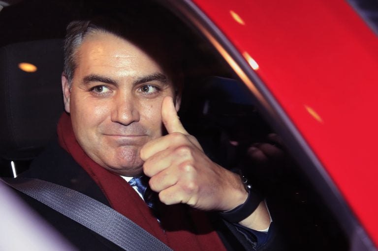 CNN's Jim Acosta gestures as he leaves federal court in Washington, Wednesday, Nov. 14, 2018, following a hearing on a legal challenge against President Donald Trump's administration over the revocation of his White House 