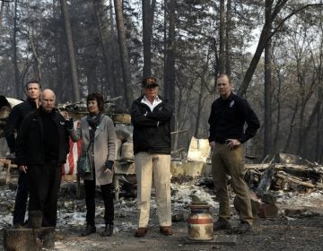 President Donald Trump talks with from left, Gov.-elect Gavin Newsom, California Gov. Jerry Brown, Paradise Mayor Jody Jones and FEMA Administrator Brock Longduring a visit to a neighborhood destroyed by the wildfires, Saturday, Nov. 17, 2018, in Paradise, Calif. (AP Photo/Evan Vucci)