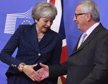 European Commission President Jean-Claude Juncker (right), shakes hands with British Prime Minister Theresa May prior to a meeting at EU headquarters in Brussels, Saturday, Nov. 24, 2018. British Prime Minister Theresa May is kicking off a big Brexit weekend by traveling to EU headquarters in Brussels for talks on Saturday with key leaders. (Geert Vanden Wijngaert/AP)