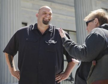 In this April 14, 2016, file photo, Braddock, Pa., then-Mayor, now Lt Gov-elect John Fetterman meets with people following a news conference he held in Norristown, Pa. (Matt Rourke/AP Photo, File)