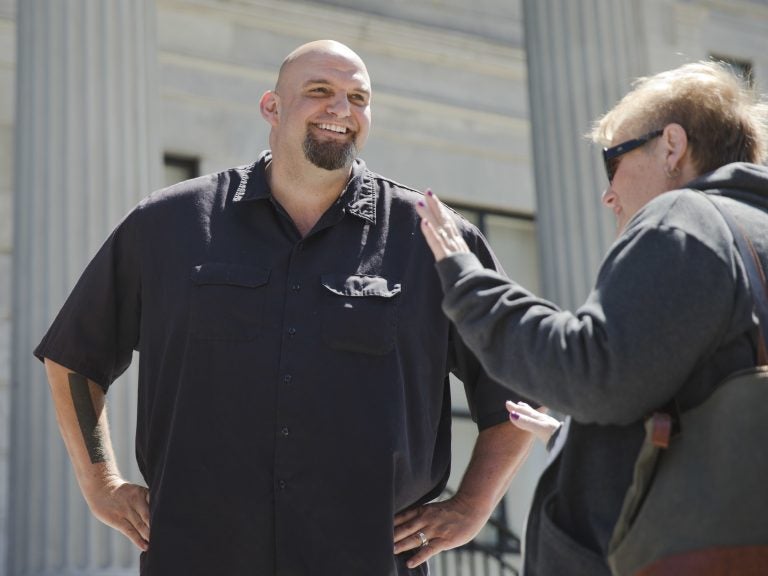 In this April 14, 2016, file photo, Braddock, Pa., then-Mayor, now Lt Gov-elect John Fetterman meets with people following a news conference he held in Norristown, Pa. (Matt Rourke/AP Photo, File)