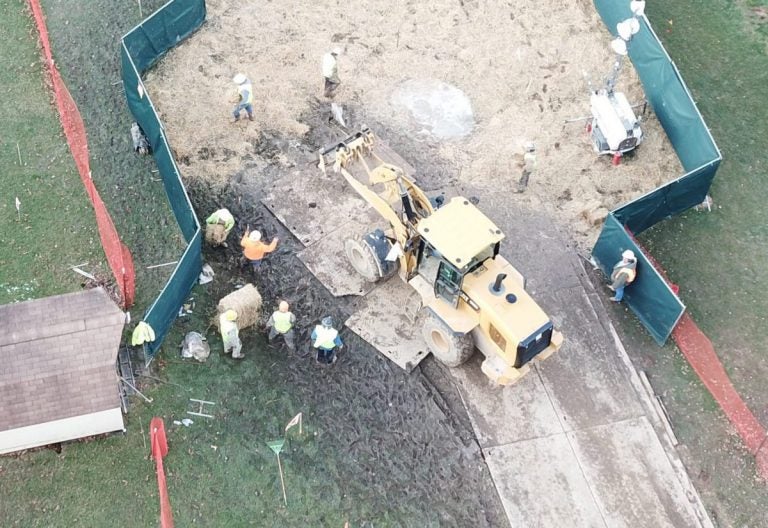 Crews work to stabilize sinkholes in a West Whiteland Township, Chester County neighborhood on March 3. The sinkholes appeared near a construction site for the Mariner East 2 pipeline. (Eric Friedman)