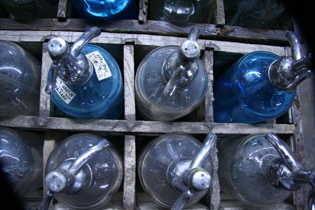 Seltzer men deliver the drink in thick glass bottles with a metal trigger. It withstands the high pressure and keeps the drink fizzy for a longer time than a plastic bottle would. (Alan Yu/WHYY)